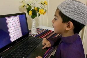 child reading quran